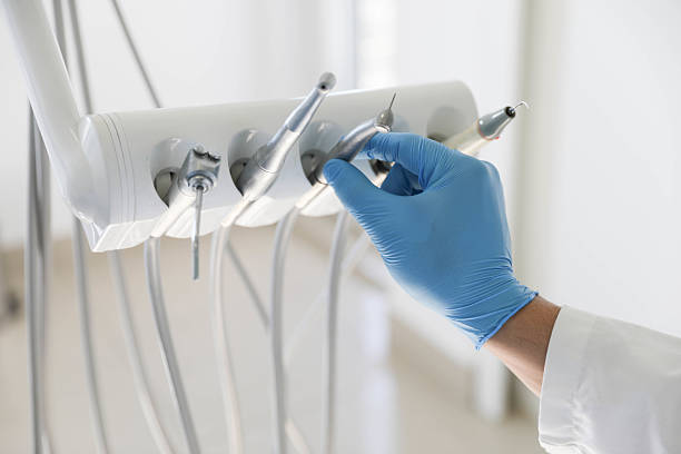 Professional Tooth Extraction technician working in Home Gardens, CA
